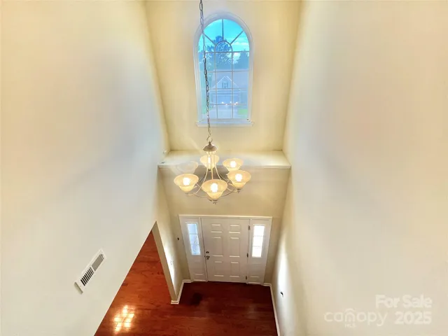 a view of a porch with a door and a yard