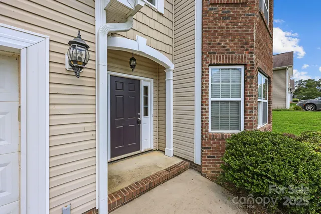 a view of an empty room with windows
