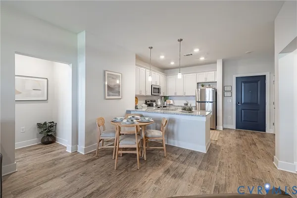 a kitchen with a table and chairs in it