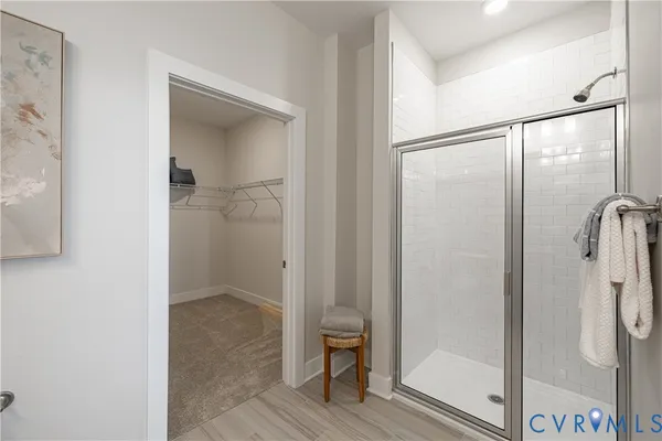 a view of bathroom with a glass shower door