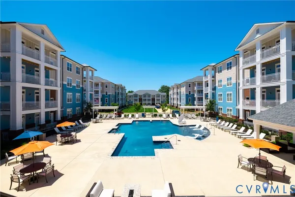 a view of a swimming pool with a lounge chairs