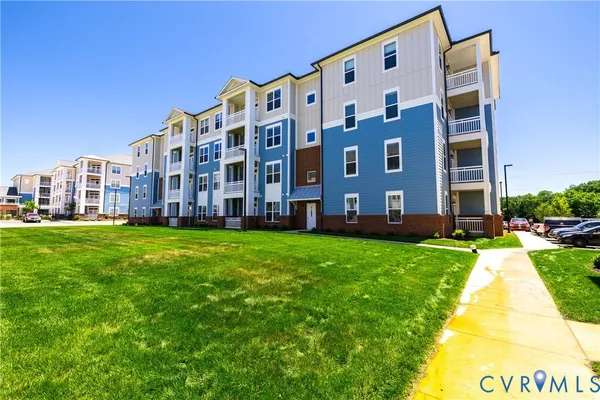 a view of a building with a yard