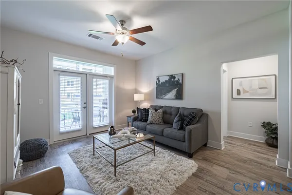 a living room with furniture and a window