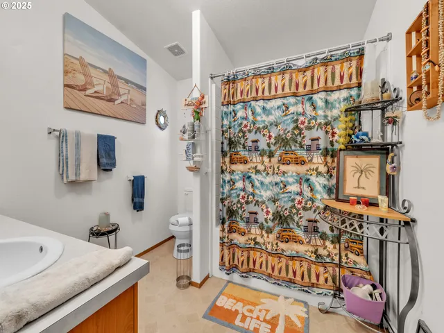a bathroom with a sink and a shower curtain