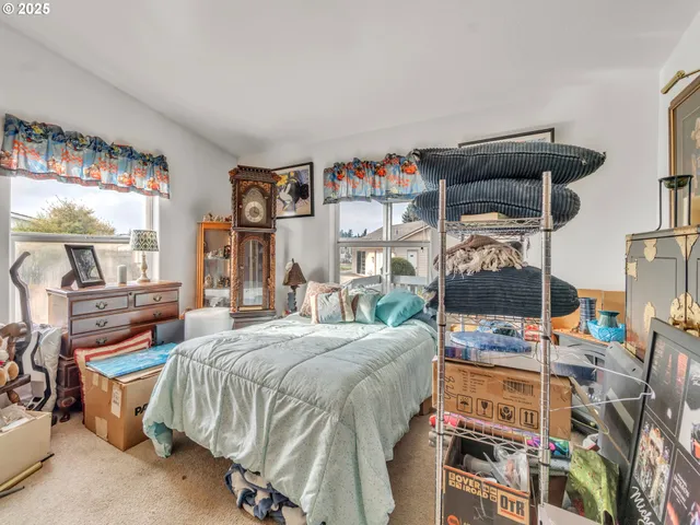 a bed room with a bed and a window