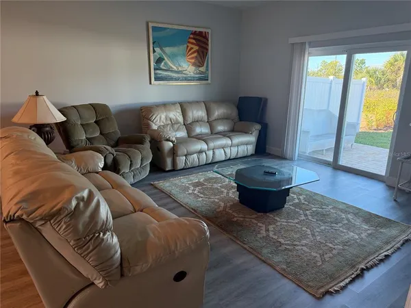 a living room with furniture and a rug
