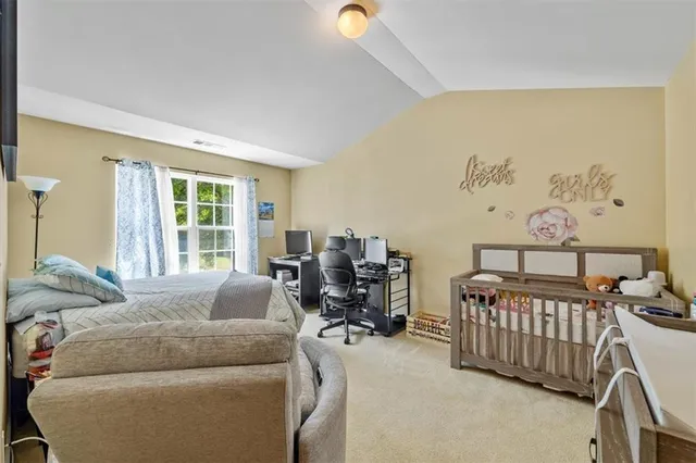 a bedroom with furniture and a window