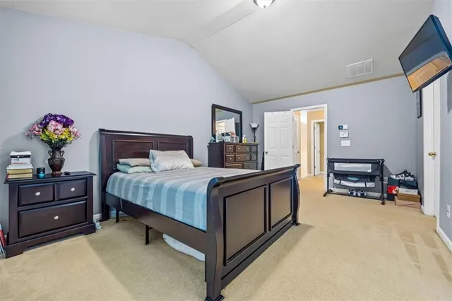 a view of walk in closet with clothes