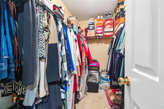 a bathroom with a double vanity sink mirror and toilet