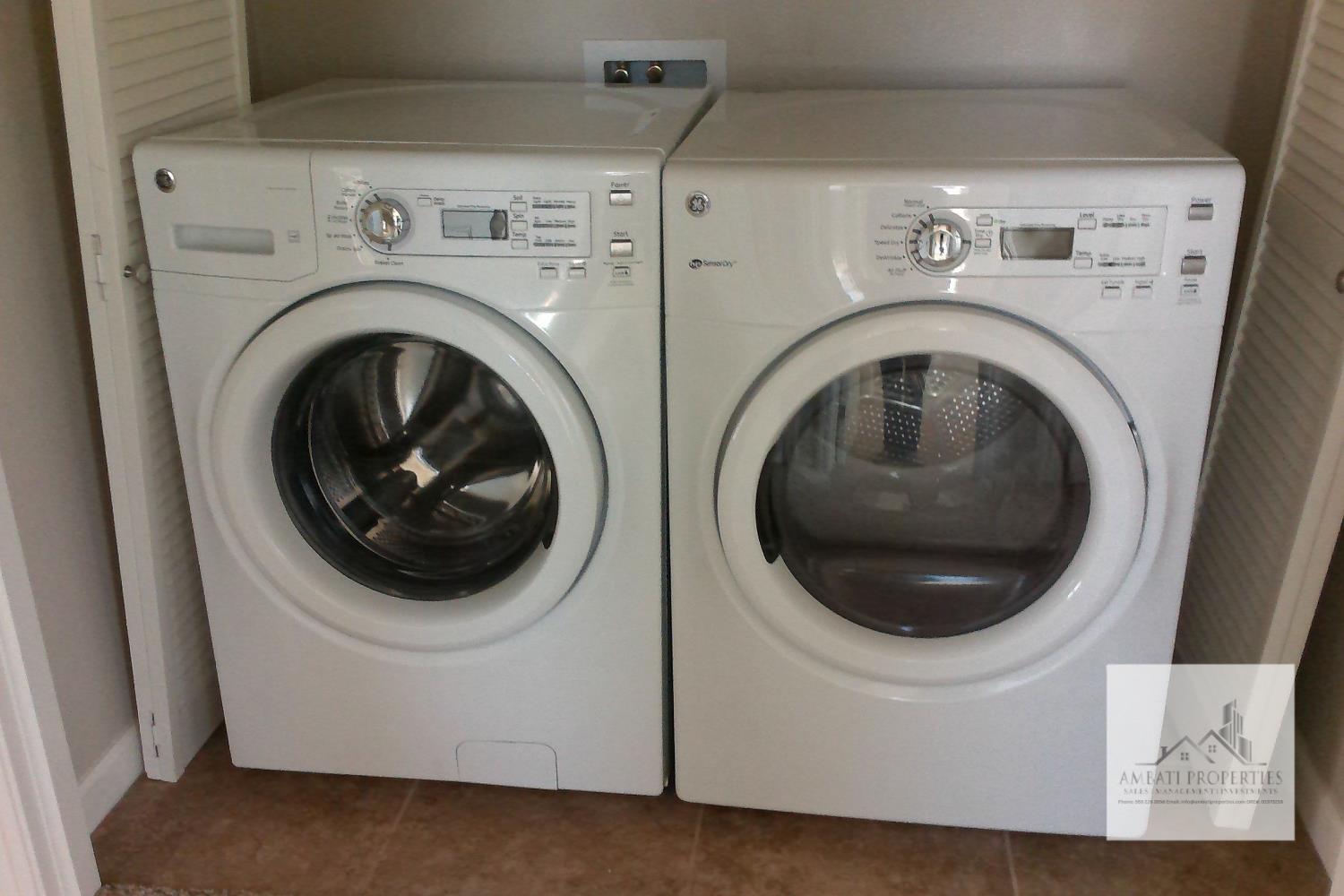 3539 Luminary Way Clovis, CA 93619 - Photo 12 of 13 a utility room with dryer and washer