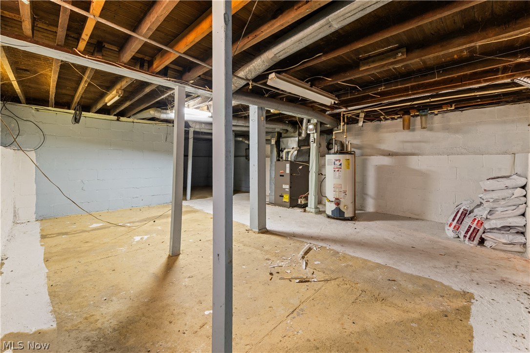 409 Edith Avenue Akron, OH 44312 - Photo 27 of 45 Unfinished basement featuring exposed wood ceiling joists and support columns