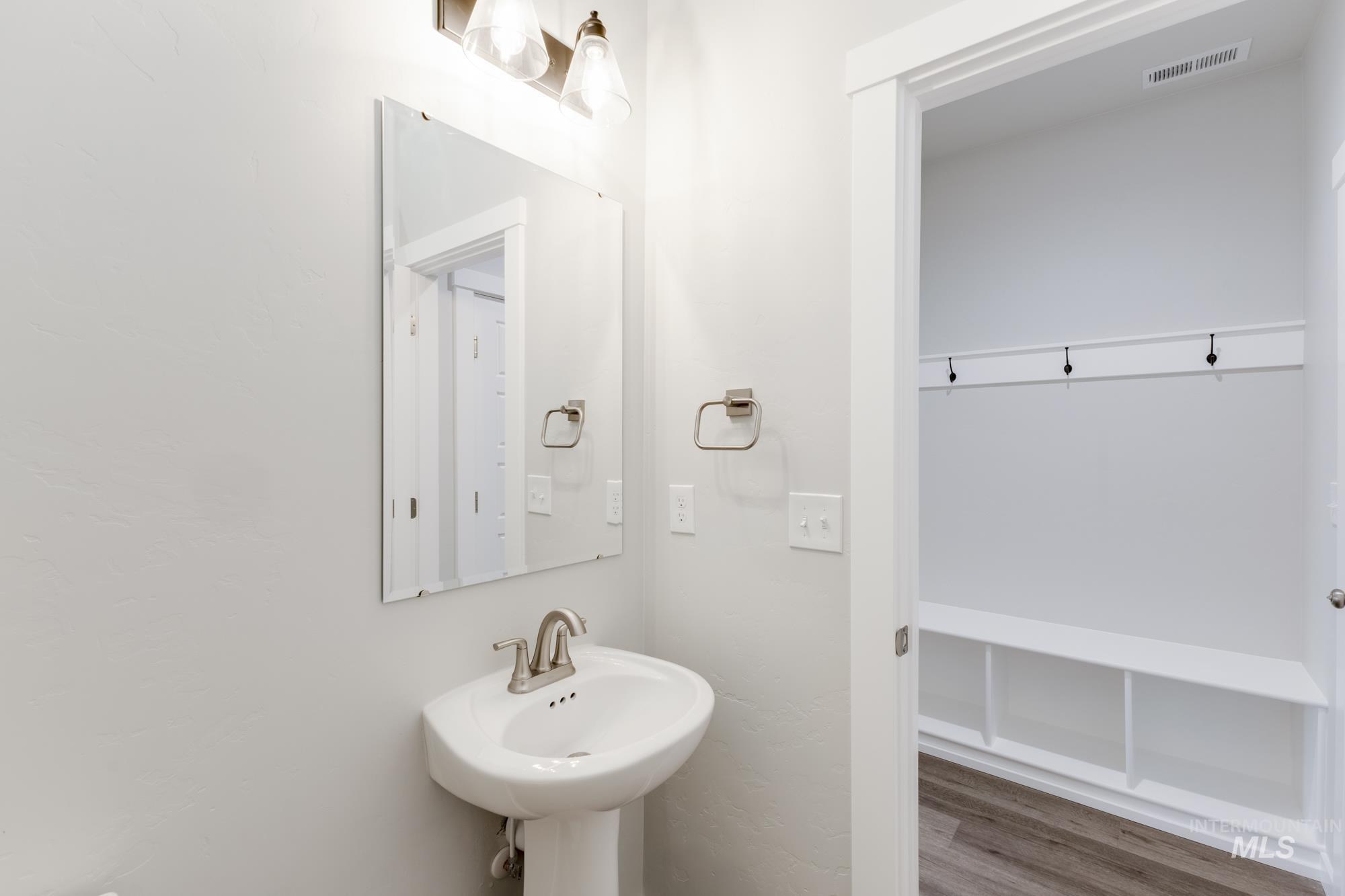 903 North Mirror Creek Way Meridian, ID 83642 - Photo 11 of 24 Bathroom featuring wood finished floors and a sink