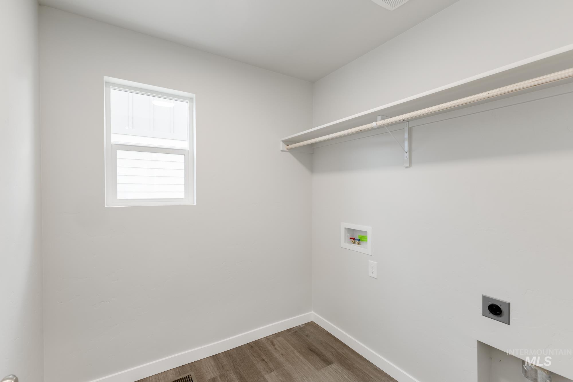 903 North Mirror Creek Way Meridian, ID 83642 - Photo 18 of 24 Washroom with electric dryer hookup, wood finished floors, and washer hookup