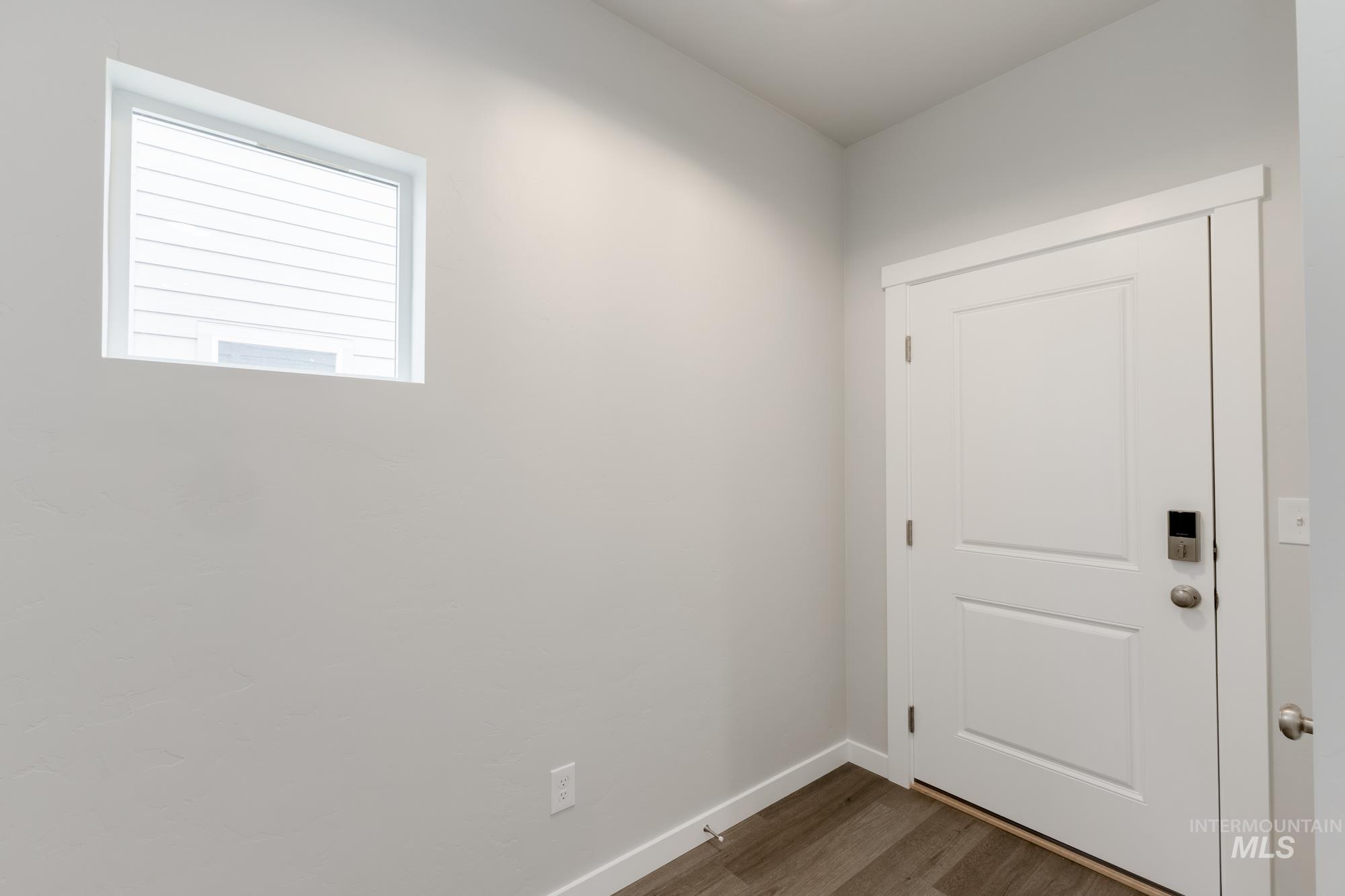 903 North Mirror Creek Way Meridian, ID 83642 - Photo 2 of 24 Doorway with wood finished floors and baseboards