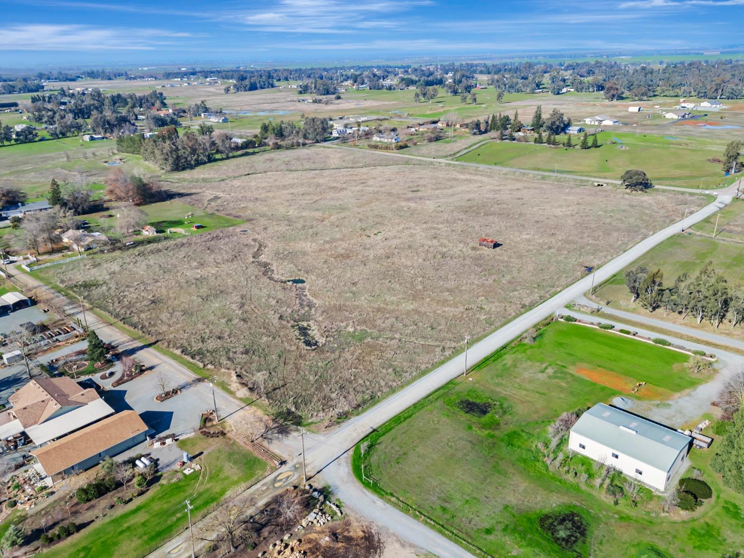 an aerial view of a golf course with a yard