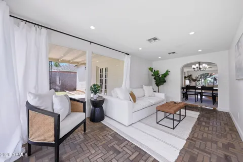 a living room with furniture and a large window