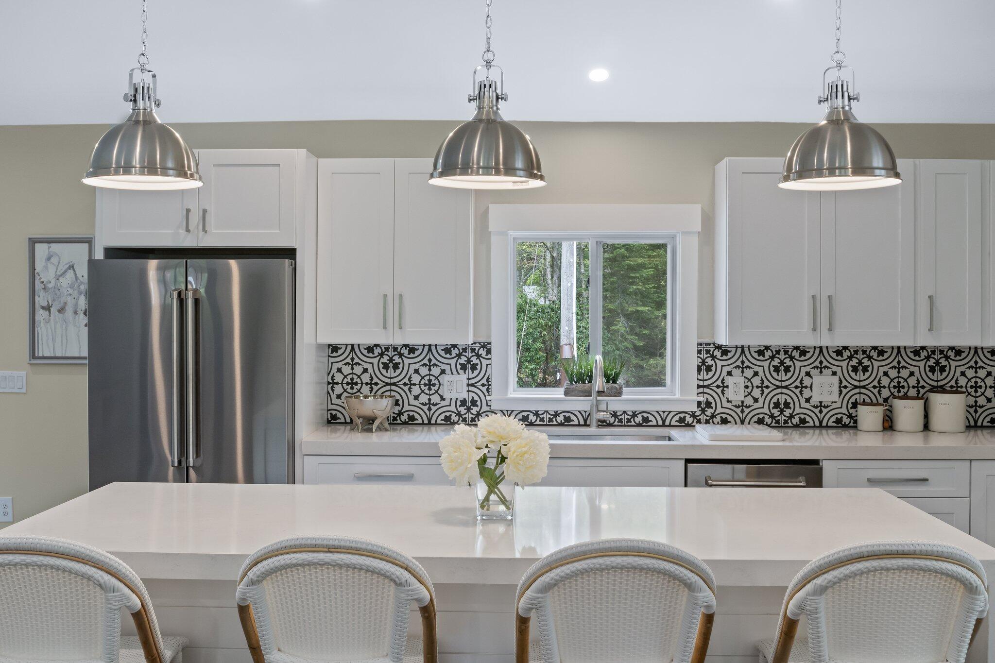 169 Old Post Road Centerville, MA 02632 - Photo 15 of 53 a kitchen with stainless steel appliances a sink cabinets and a window