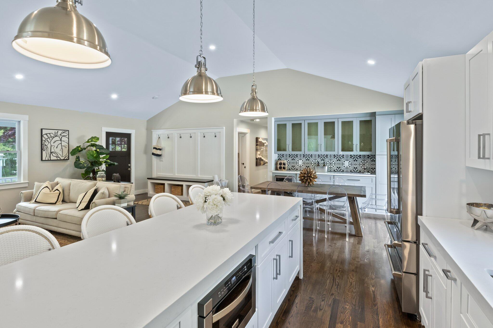 169 Old Post Road Centerville, MA 02632 - Photo 17 of 53 a living room with furniture a wooden floor and a chandelier
