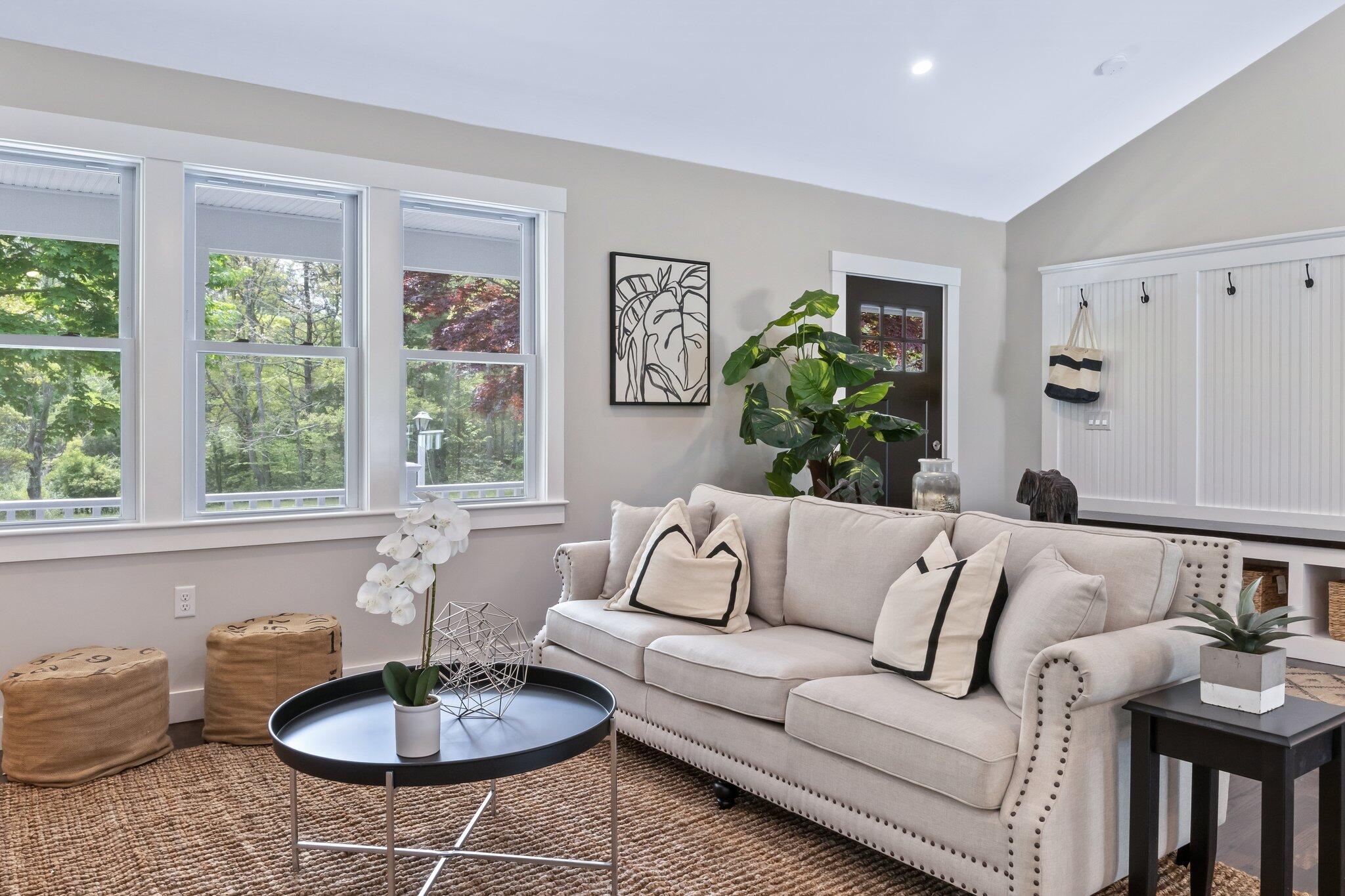 169 Old Post Road Centerville, MA 02632 - Photo 18 of 53 a living room with furniture and a table