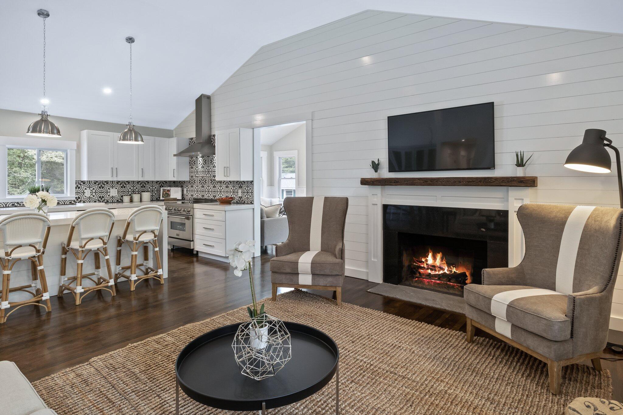 169 Old Post Road Centerville, MA 02632 - Photo 21 of 53 a living room with furniture and a fireplace