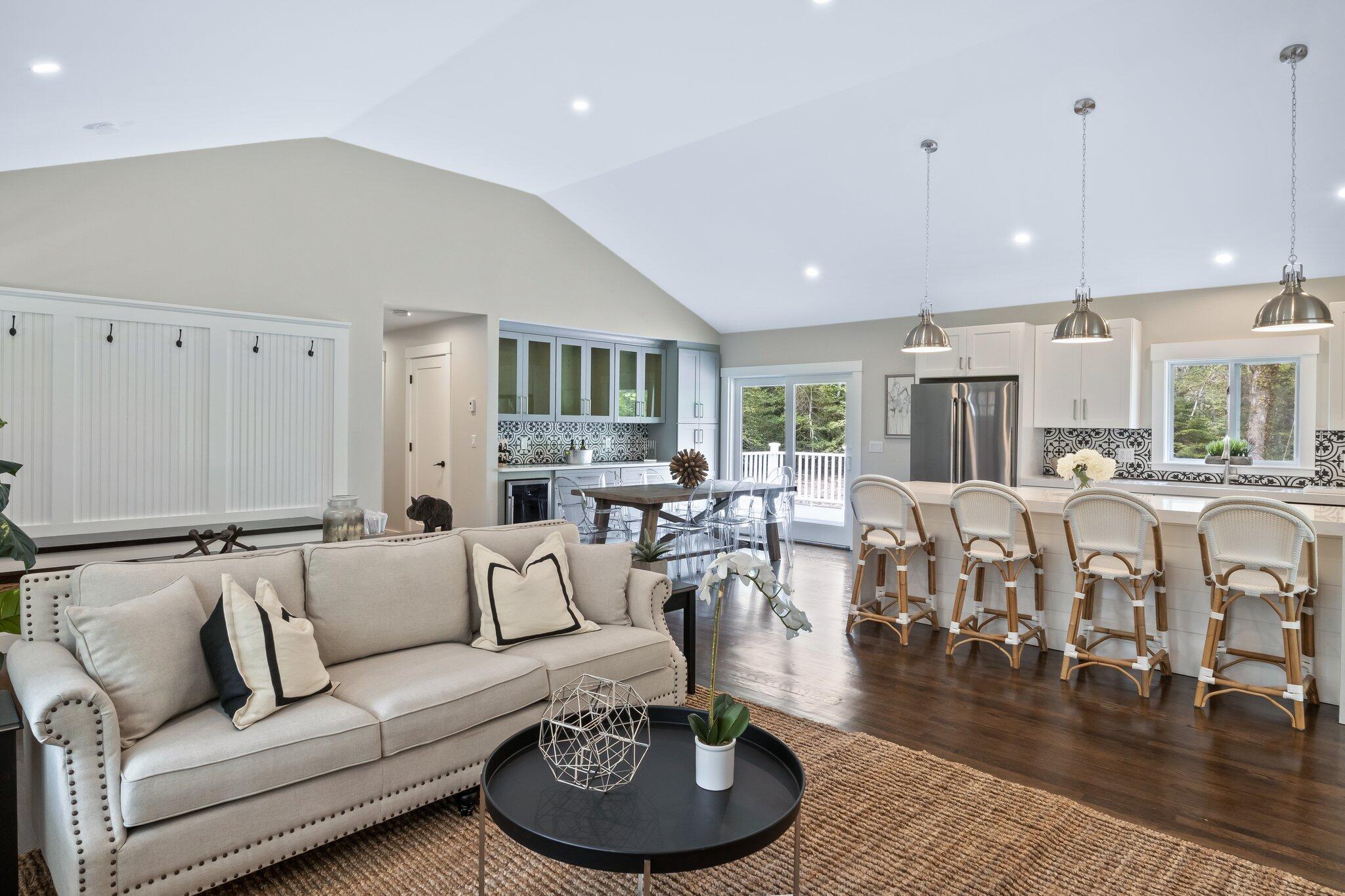 169 Old Post Road Centerville, MA 02632 - Photo 22 of 53 a living room with lots of furniture and a wooden floor