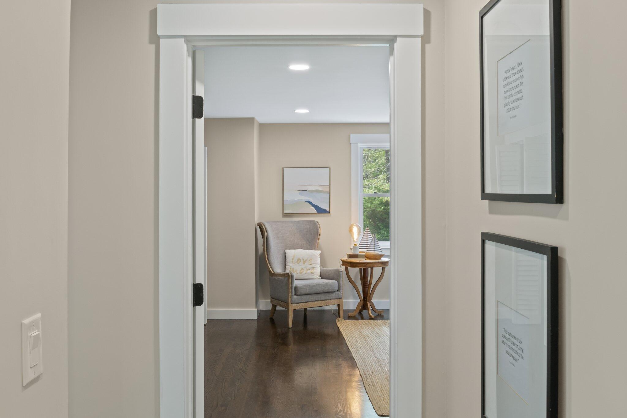 169 Old Post Road Centerville, MA 02632 - Photo 28 of 53 a view of a hallway with wooden floor windows and a bathroom