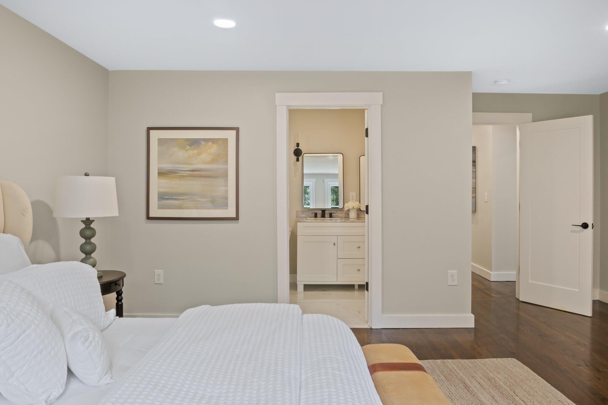 169 Old Post Road Centerville, MA 02632 - Photo 34 of 53 a bedroom with a bed and wooden floor