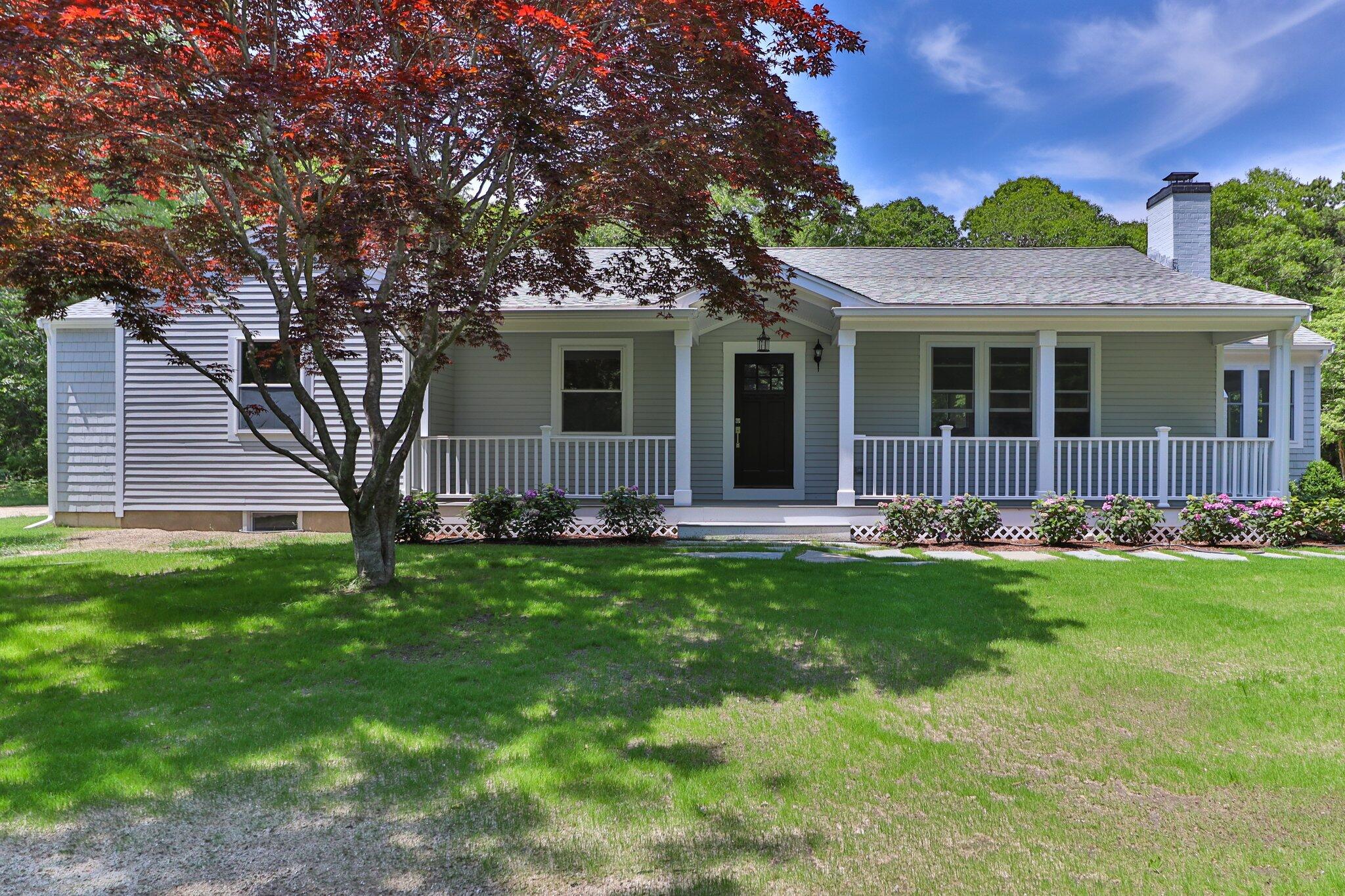 169 Old Post Road Centerville, MA 02632 - Photo 41 of 53 a front view of a house with a garden