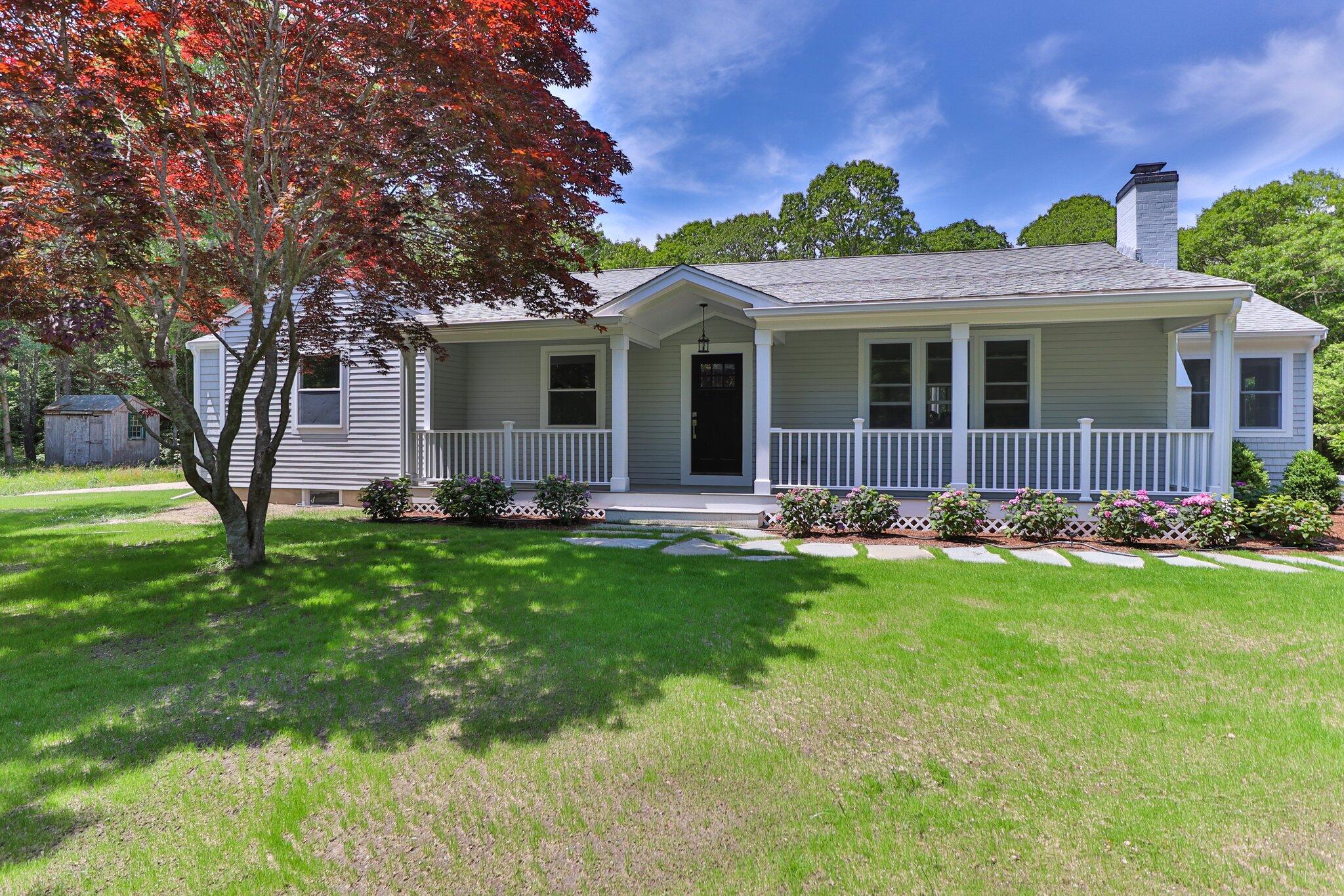 169 Old Post Road Centerville, MA 02632 - Photo 43 of 53 a front view of house with yard and green space