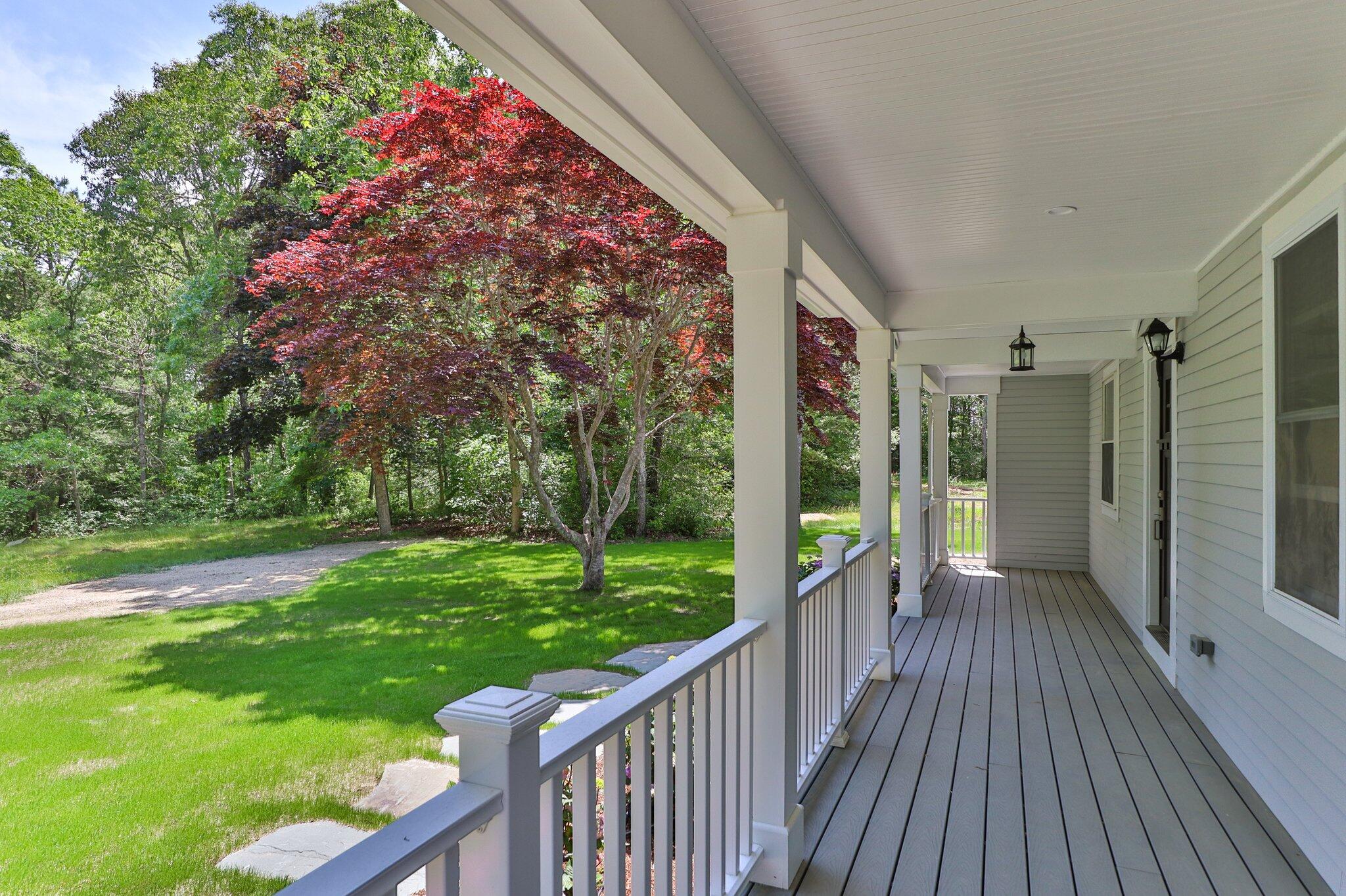 169 Old Post Road Centerville, MA 02632 - Photo 50 of 53 a view of a porch with a yard