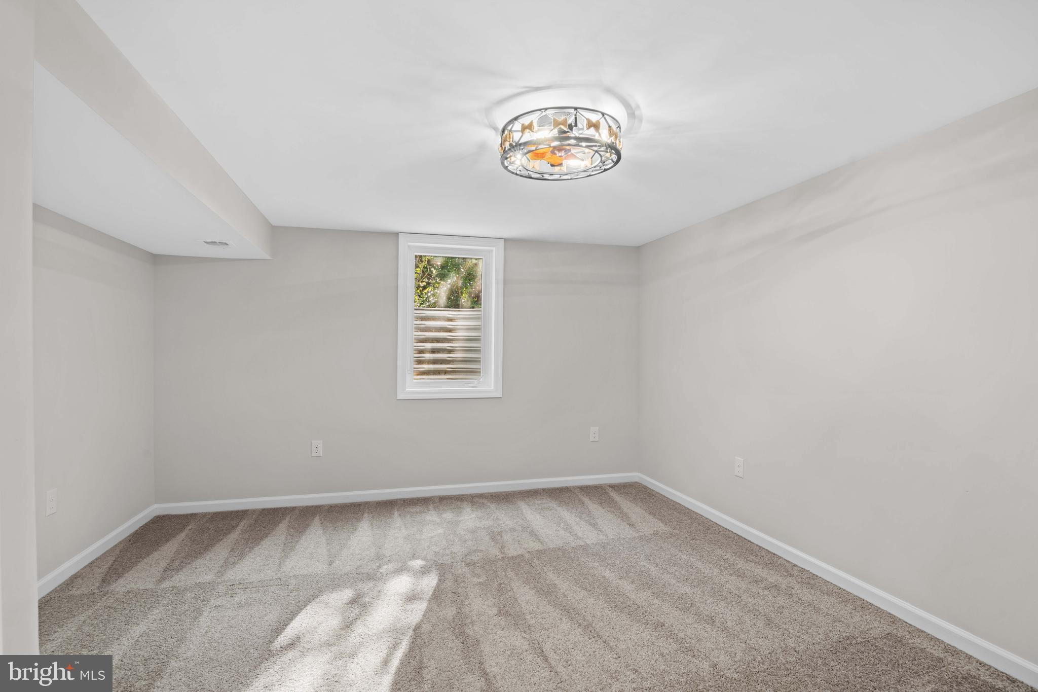 15388 Point Lookout Road St. Inigoes, MD 20684 - Photo 24 of 29 an empty room with a window