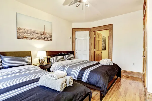 a bedroom with bed and a couch