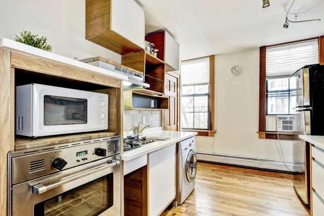a kitchen with a stove and a microwave