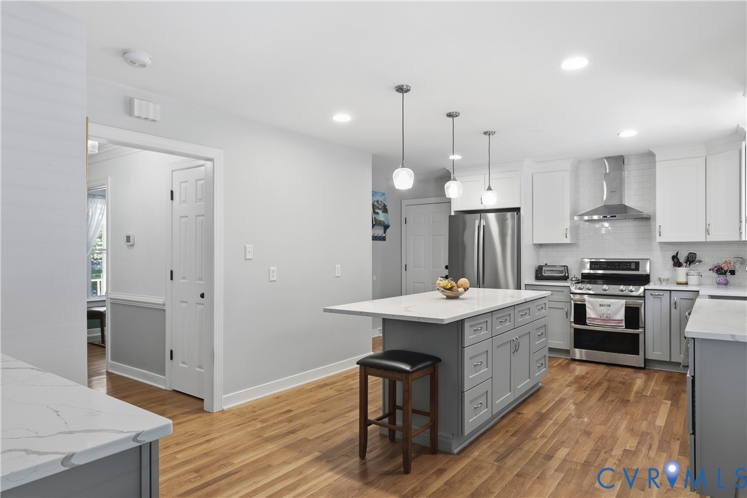 12512 2nd Branch Road Chesterfield, VA 23838 - Photo 13 of 56 a kitchen that has a lot of cabinets in it and wooden floors