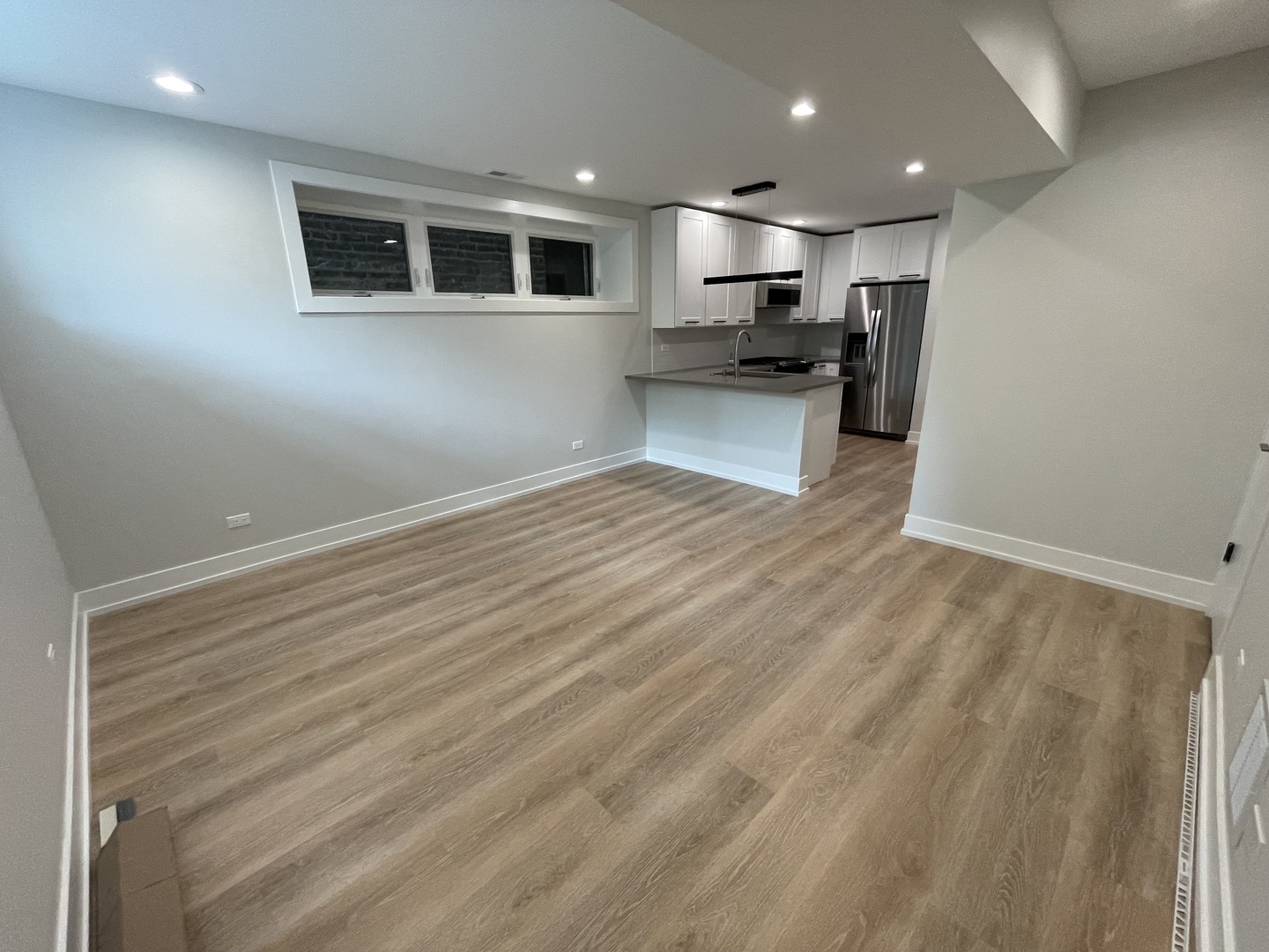 Undisclosed Address Chicago, IL 60622 - Photo 3 of 13 a view of kitchen with kitchen island microwave and stove