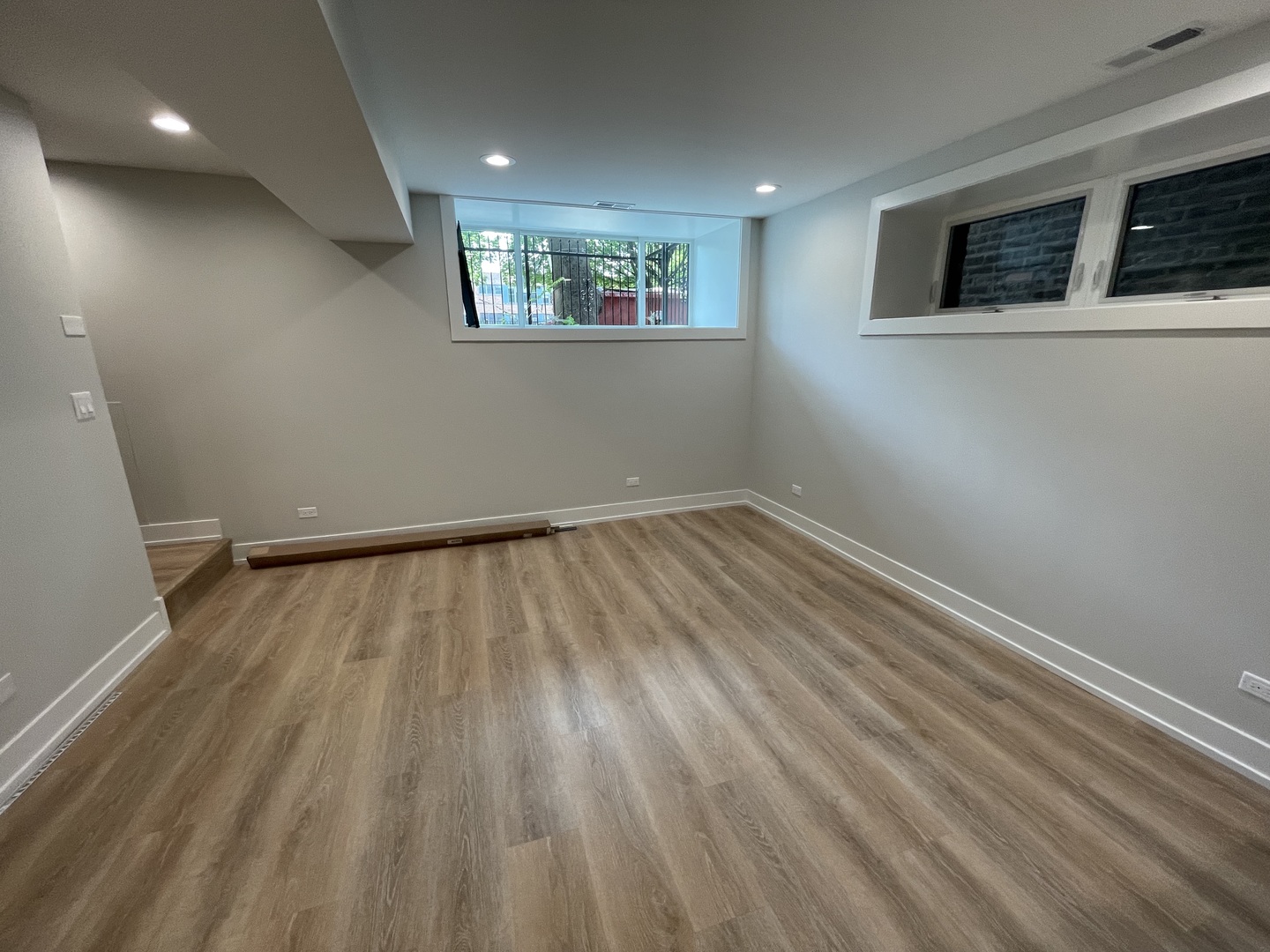 Undisclosed Address Chicago, IL 60622 - Photo 4 of 13 a view of an empty room with wooden floor and a window