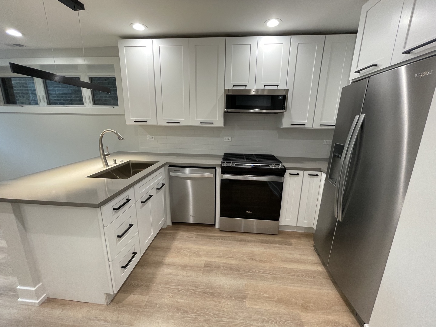 Undisclosed Address Chicago, IL 60622 - Photo 6 of 13 a kitchen with stainless steel appliances granite countertop a sink stove and refrigerator