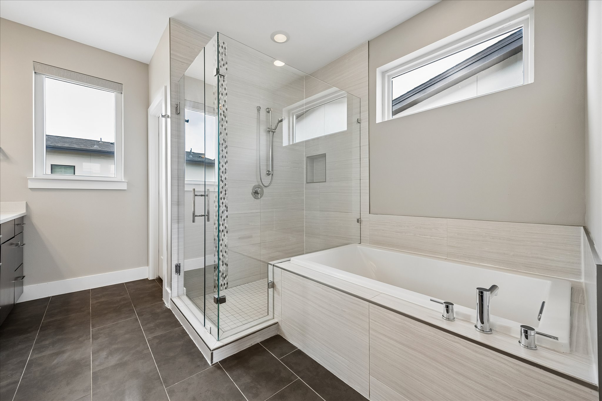 5006 Pecan Springs Road, Unit 6 Austin, TX 78723 - Photo 19 of 30 Indulge in a pristine primary bathroom, featuring a deep soaking tub and a spacious walk-in shower.
