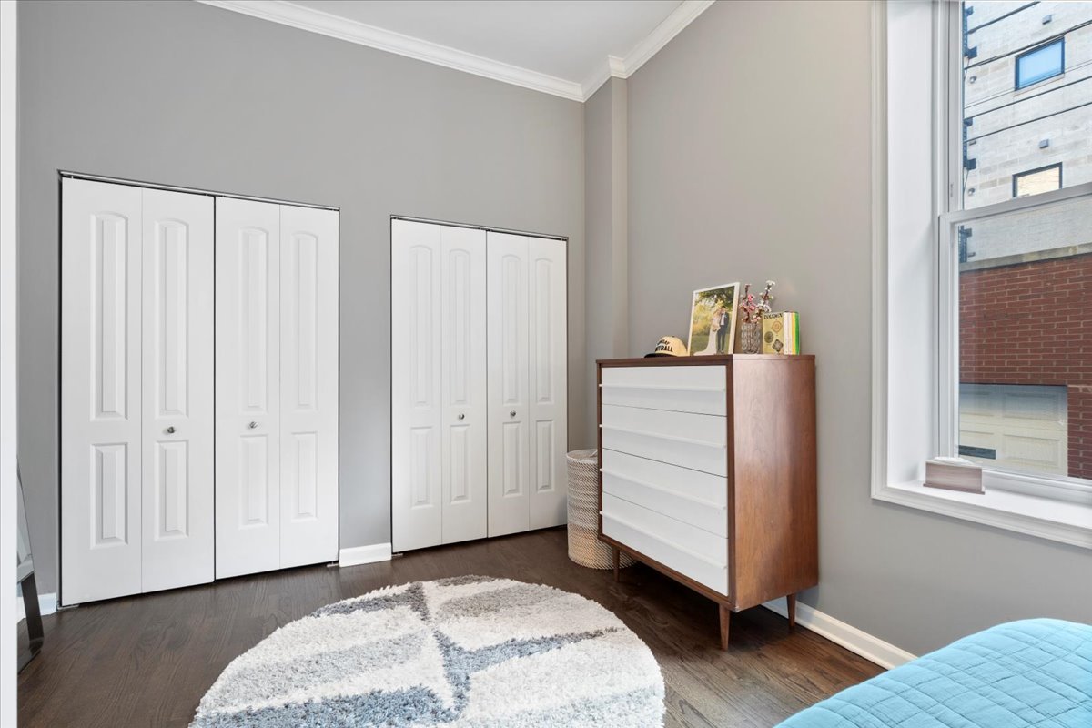 514 North Armour Street, Unit 1F Chicago, IL 60642 - Photo 11 of 18 a bedroom with a bed and a window