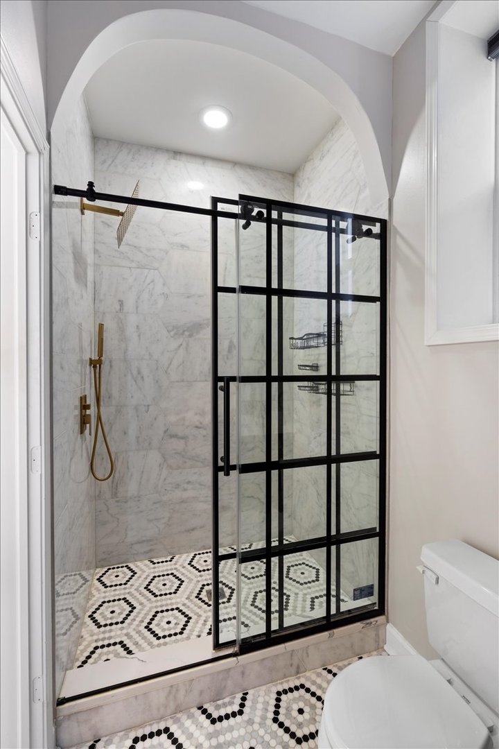 514 North Armour Street, Unit 1F Chicago, IL 60642 - Photo 13 of 18 a bathroom with a shower toilet and sink