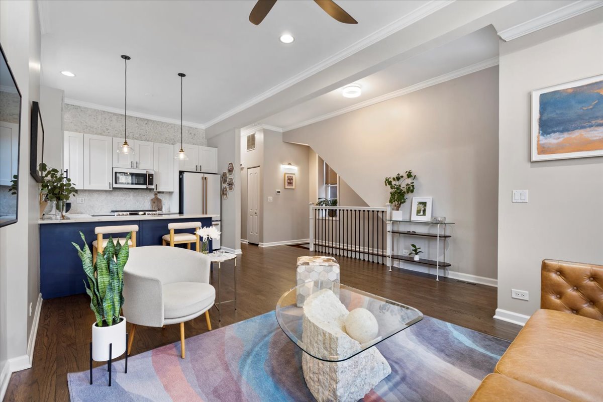 514 North Armour Street, Unit 1F Chicago, IL 60642 - Photo 2 of 18 a living room with furniture kitchen view and a wooden floor