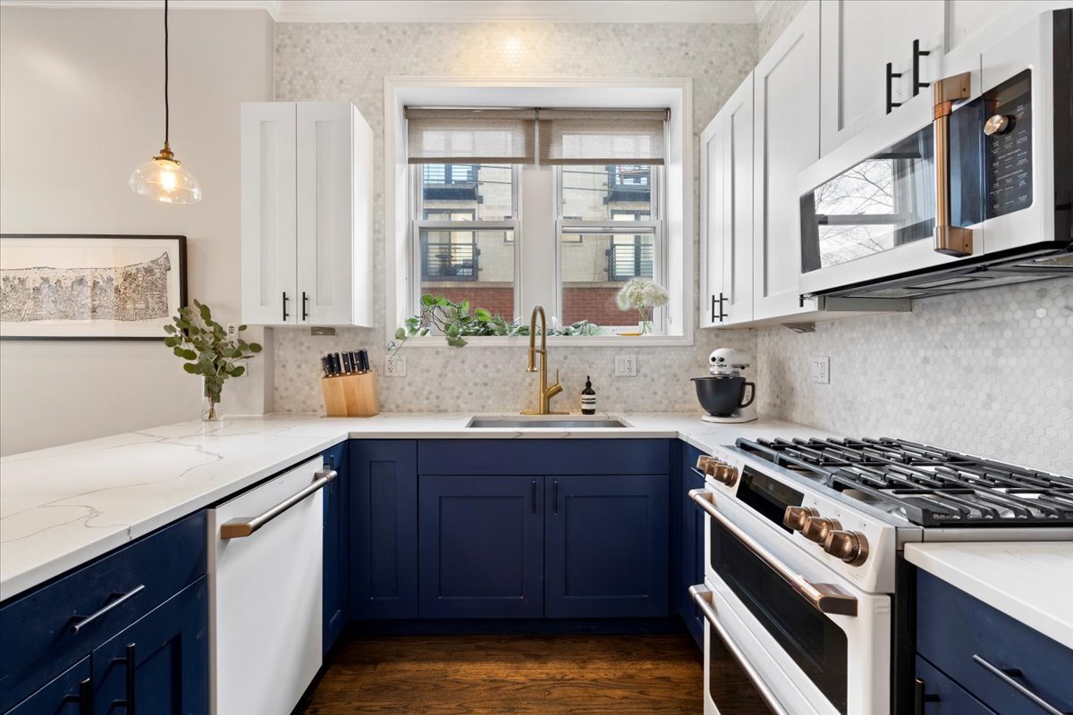 514 North Armour Street, Unit 1F Chicago, IL 60642 - Photo 8 of 18 a kitchen with stainless steel appliances a sink a stove and cabinets