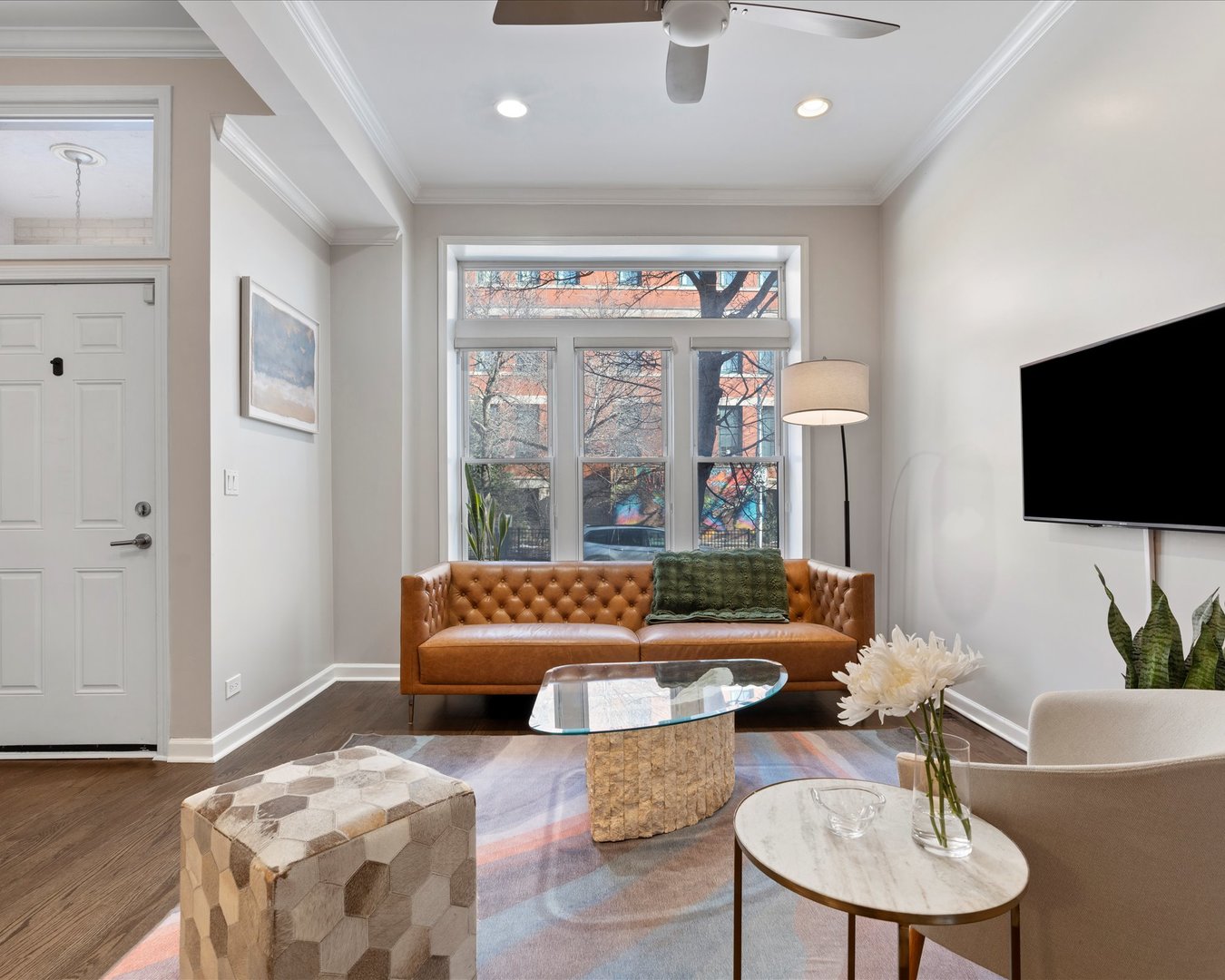 514 North Armour Street, Unit 1F Chicago, IL 60642 - Photo 9 of 18 a living room with furniture and a flat screen tv
