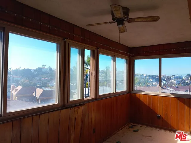 a view of a room with a large window