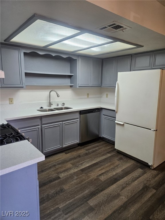 5576 West Rochelle Avenue, Unit 31A Las Vegas, NV 89103 - Photo 4 of 11 Kitchen featuring freestanding refrigerator, stainless steel dishwasher, open shelves, a sink, and gray cabinetry