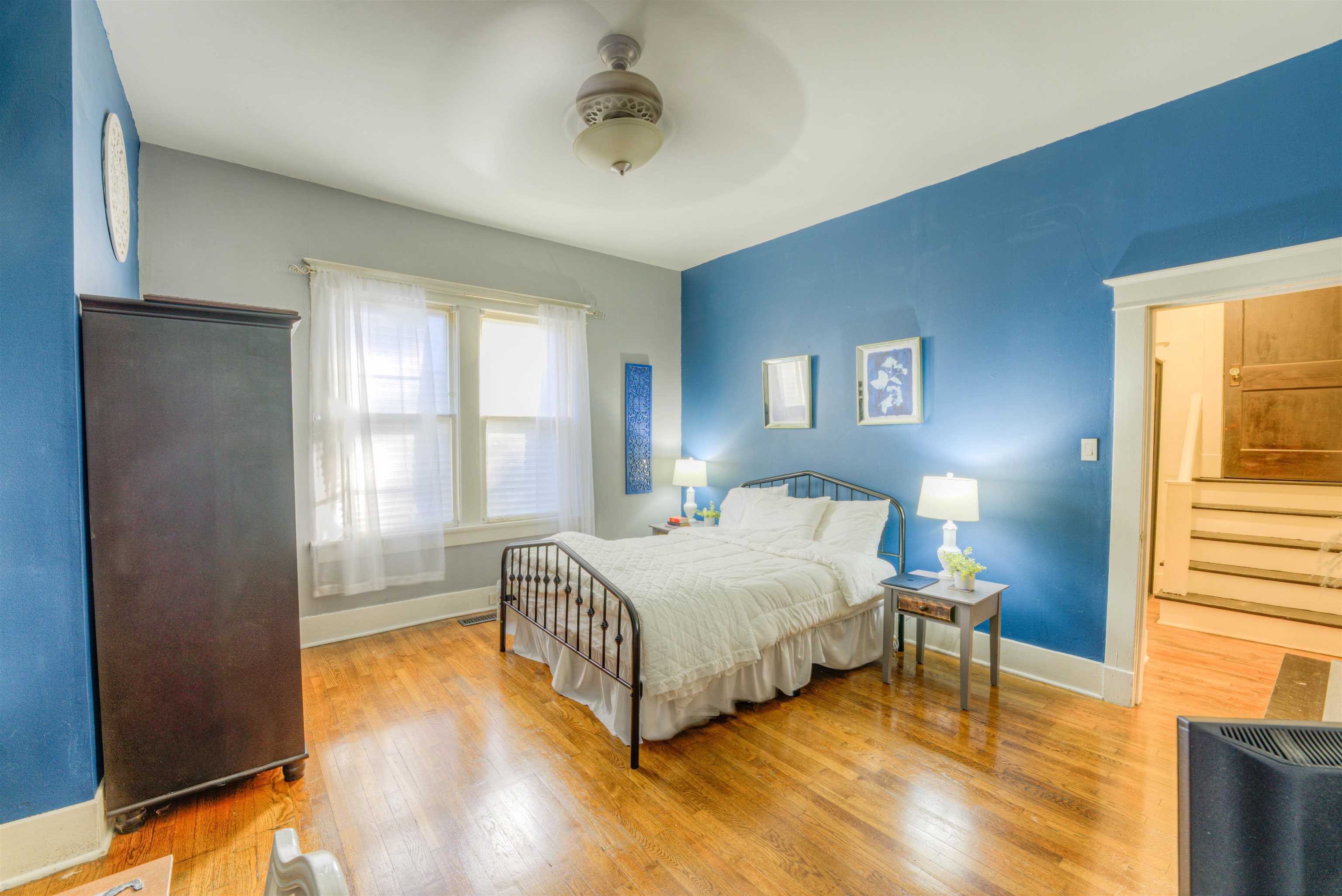 511 Ellsworth Street Memphis, TN 38111 - Photo 14 of 29 a bedroom with a bed and wooden floor