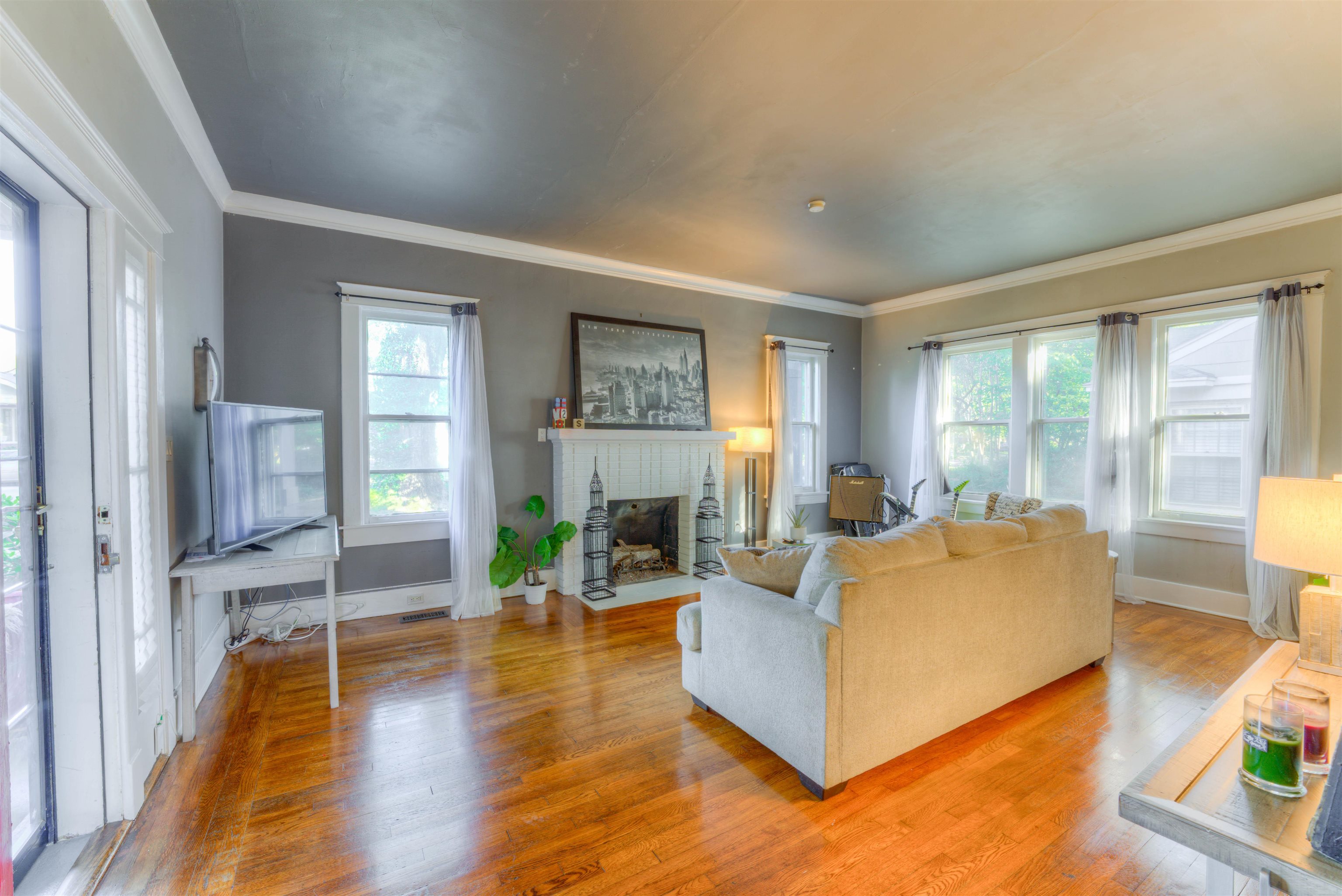 511 Ellsworth Street Memphis, TN 38111 - Photo 5 of 29 a living room with fireplace furniture and a large window