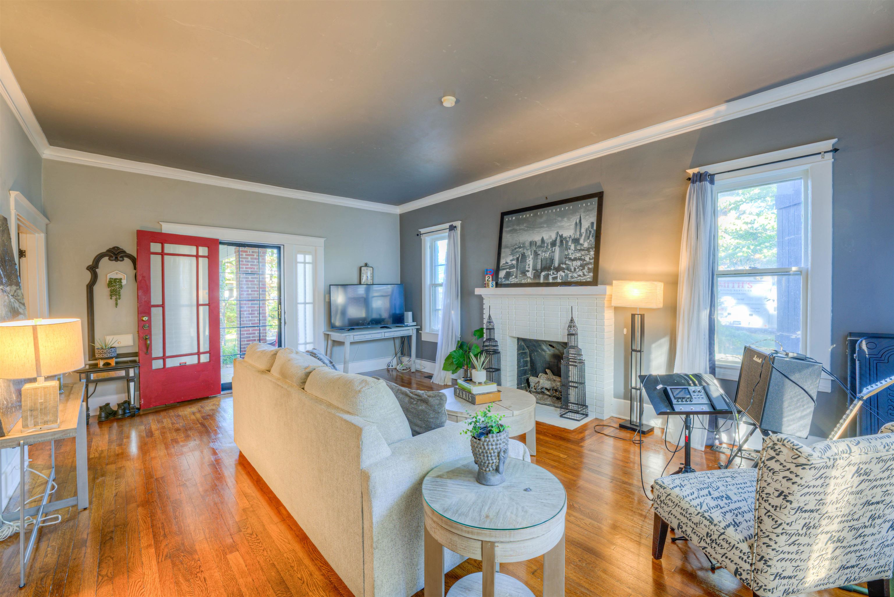 511 Ellsworth Street Memphis, TN 38111 - Photo 6 of 29 a living room with fireplace furniture and floor to ceiling windows