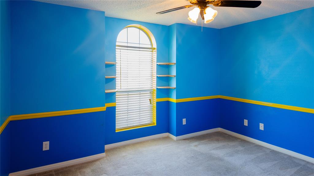 124 Topaz Circle Hewitt, TX 76643 - Photo 18 of 29 Unfurnished room with a ceiling fan, light colored carpet, and a textured ceiling