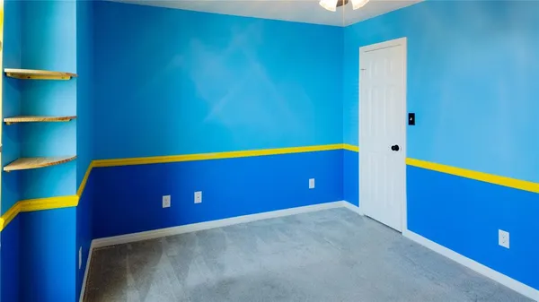 a room with pool table and painted walls